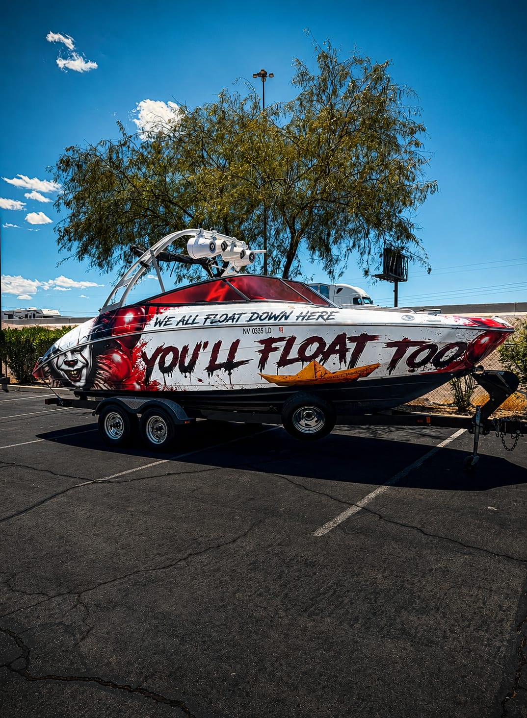 Custom boat wraps Las Vegas — Pennywise IT-themed full hull vinyl wrap installed at Purple Flare Wraps Henderson NV