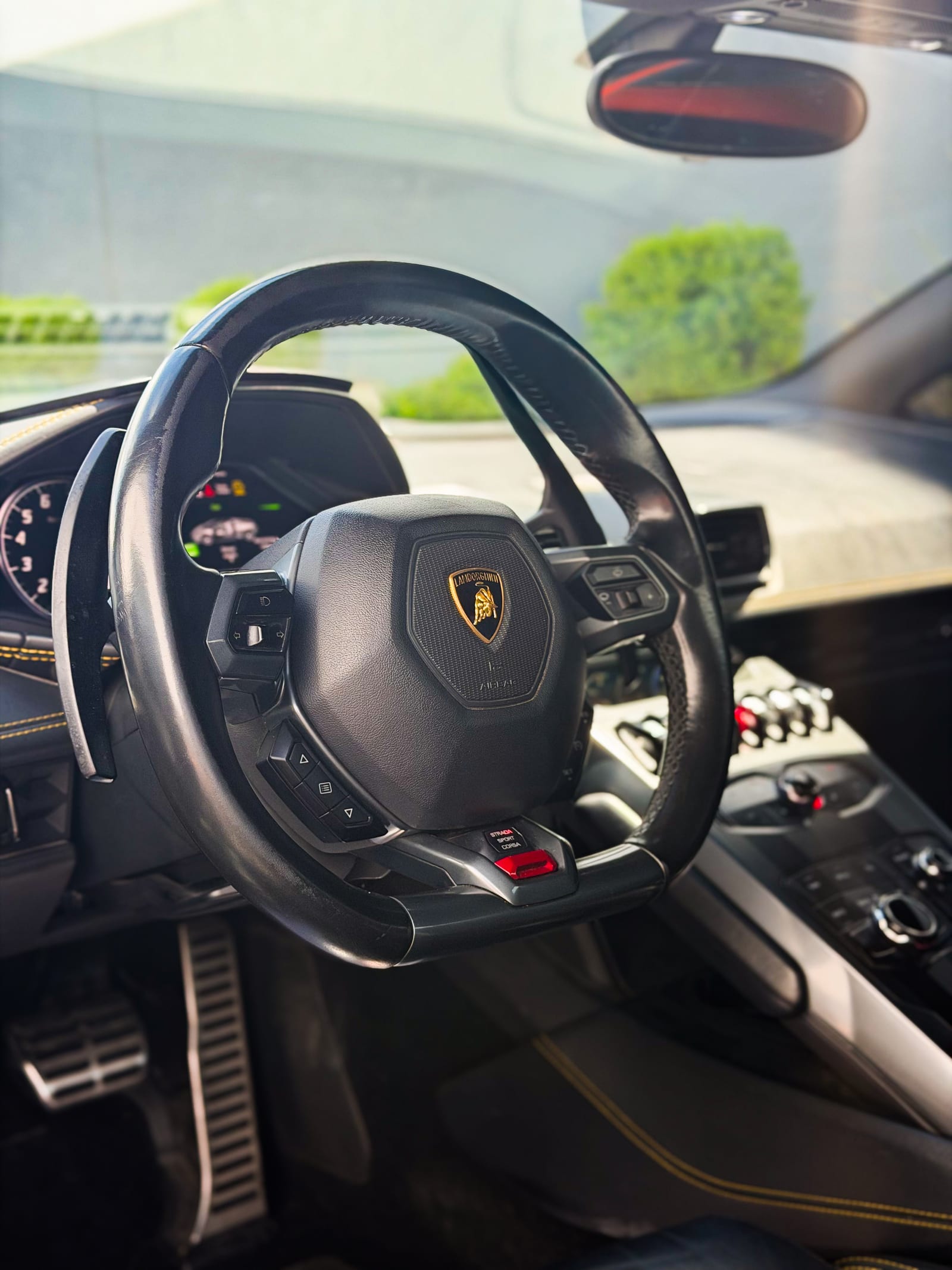 lamborghini huracan wrap — Lamborghini Huracan interior and steering wheel with yellow stitching
