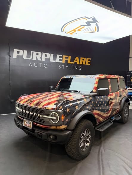 printed ppf wrap — full view of a four-door Ford Bronco in a custom printed American flag wrap at the Henderson shop