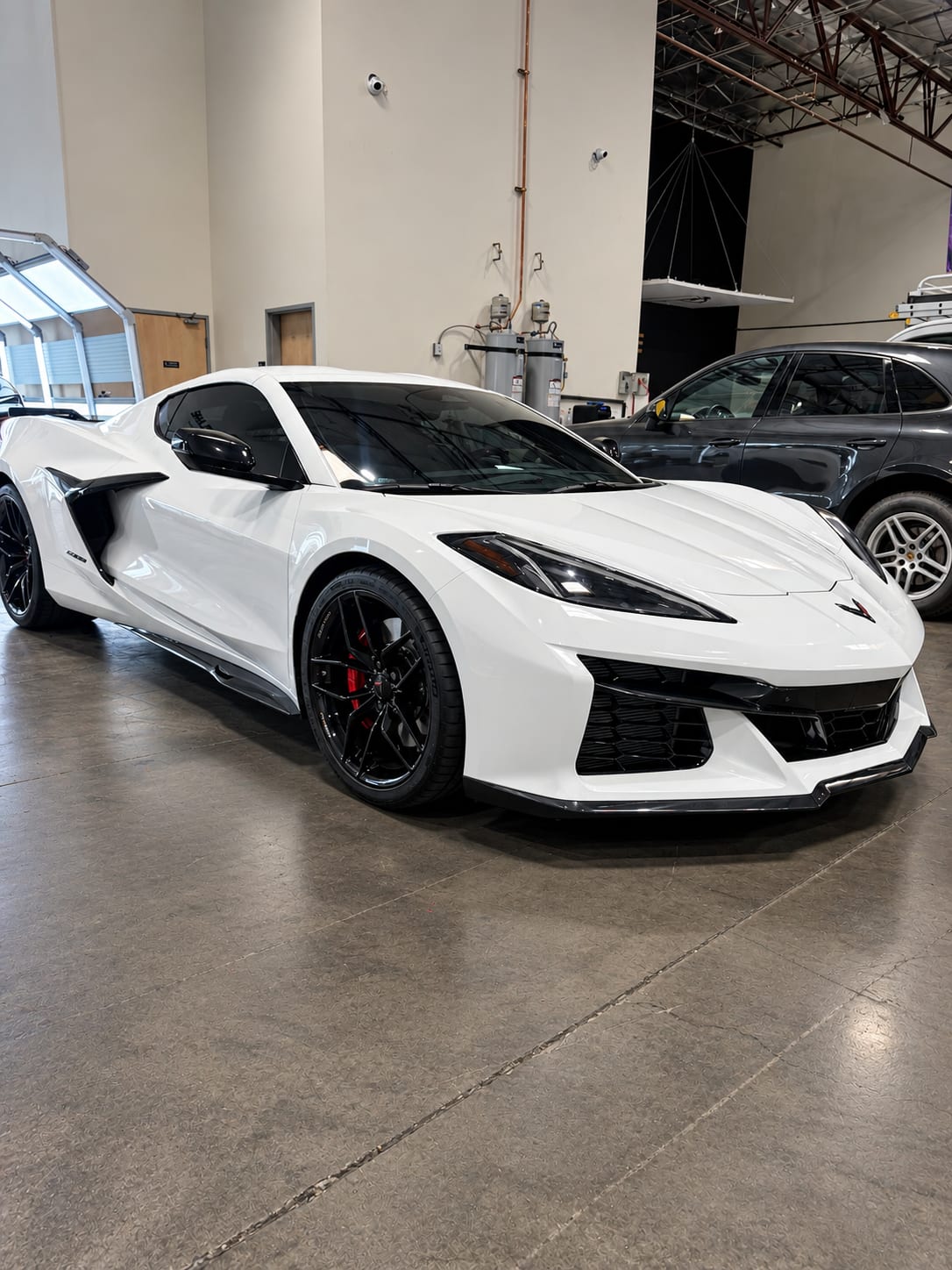 corvette z06 ppf — front three-quarter view of the white Corvette Z06 with 3M paint protection film and ceramic window tint