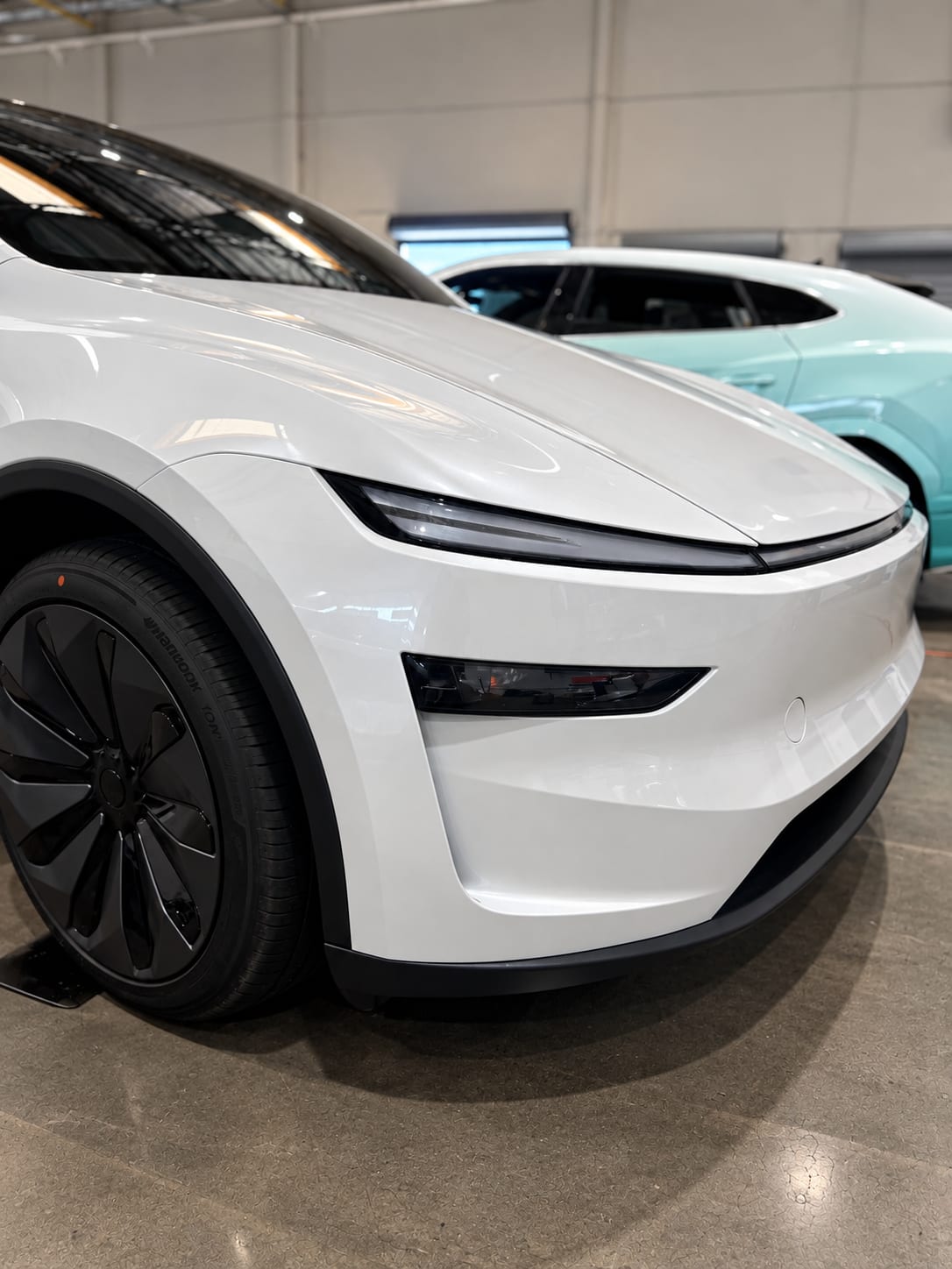 model y l ppf — front three-quarter view of the white Tesla Model Y L with full front 3M paint protection film