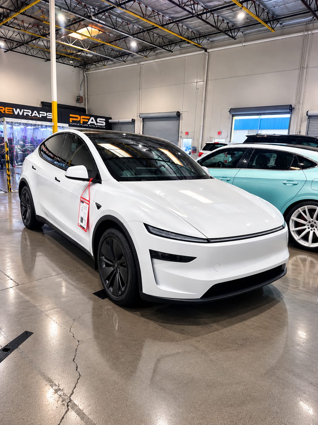 model y l ppf — white Tesla Model Y L after model y l ppf and ceramic window tint in the Henderson shop