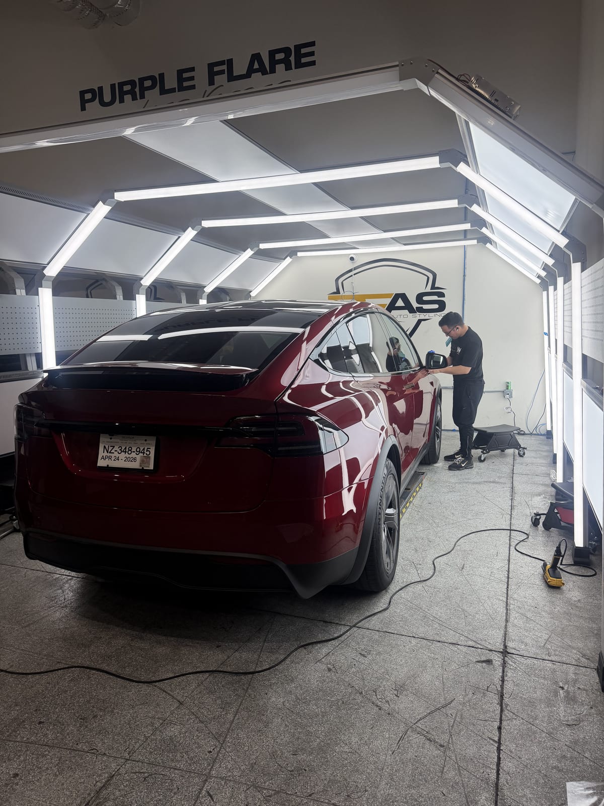 Paint protection film install on a Tesla Model X in the Purple Flare Wraps install tunnel in Henderson NV