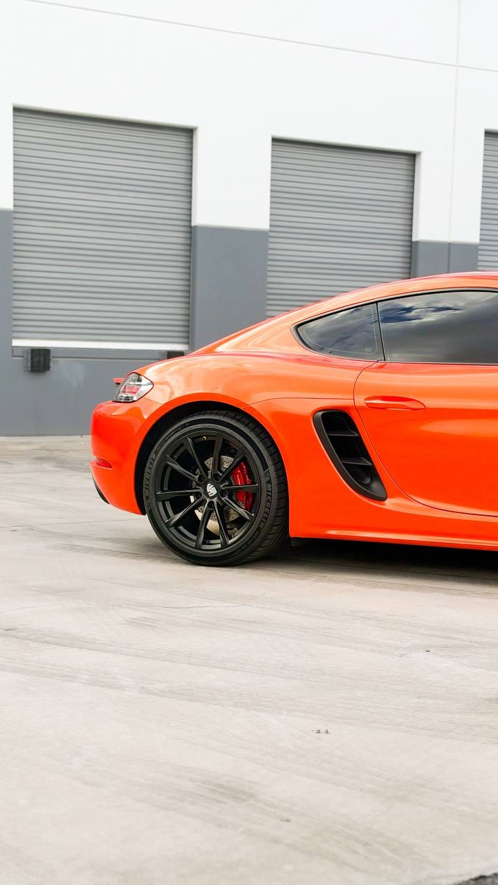 2020 Porsche 718 Cayman S color change wrap from Miami Blue to blaze orange at Purple Flare Wraps in Henderson
