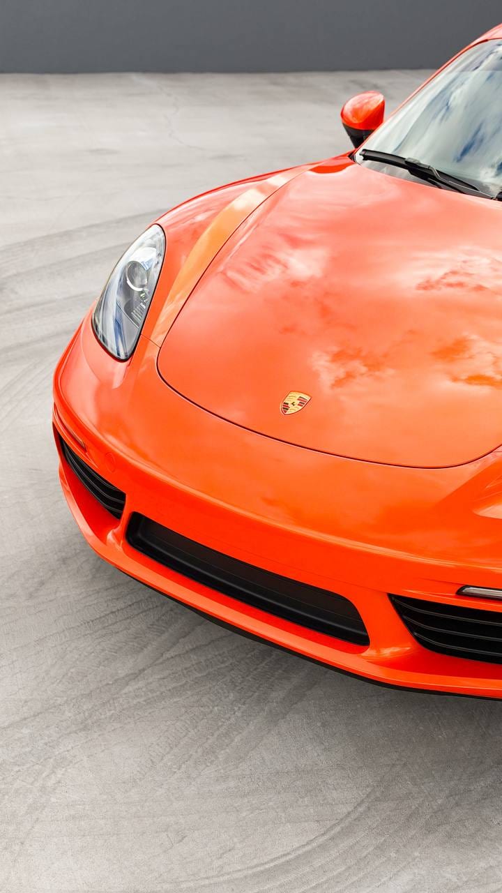 2020 Porsche 718 Cayman S color change wrap from Miami Blue to blaze orange at Purple Flare Wraps in Henderson