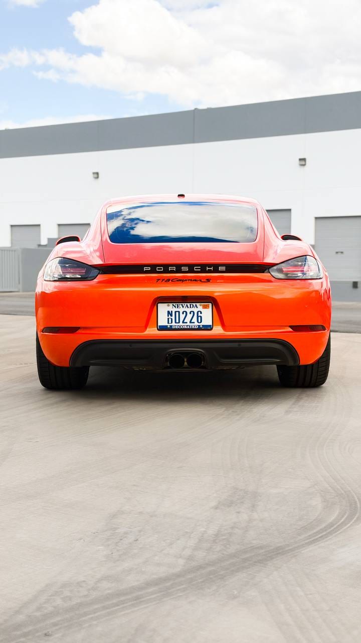 2020 Porsche 718 Cayman S color change wrap from Miami Blue to blaze orange at Purple Flare Wraps in Henderson