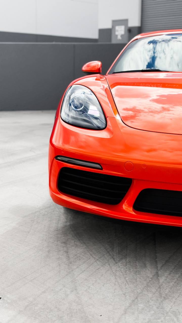 2020 Porsche 718 Cayman S color change wrap from Miami Blue to blaze orange at Purple Flare Wraps in Henderson