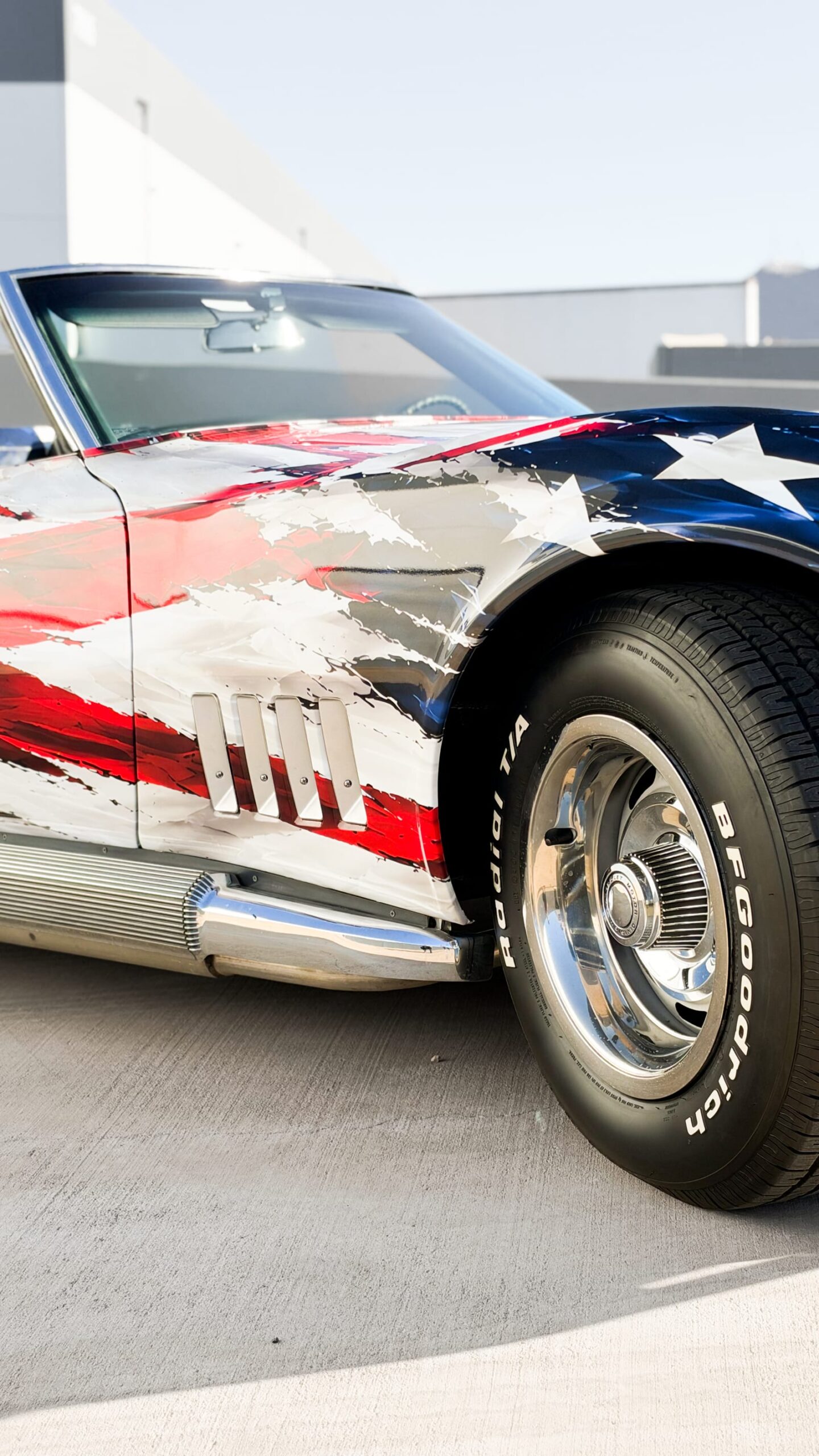1969 Chevrolet Corvette Stingray with a custom printed wrap flag design at Purple Flare Wraps Henderson