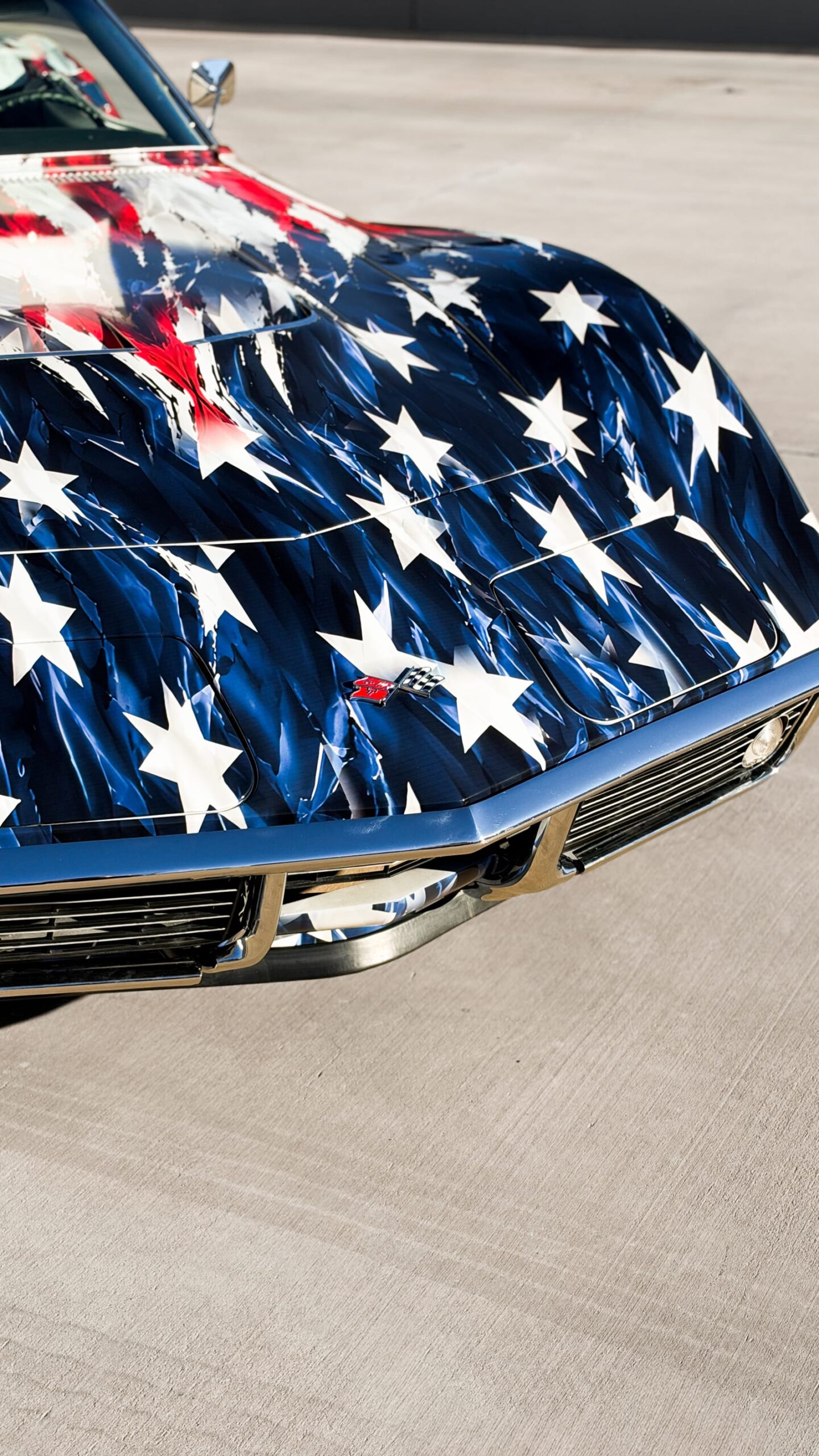 1969 Chevrolet Corvette Stingray with a custom printed wrap flag design at Purple Flare Wraps Henderson