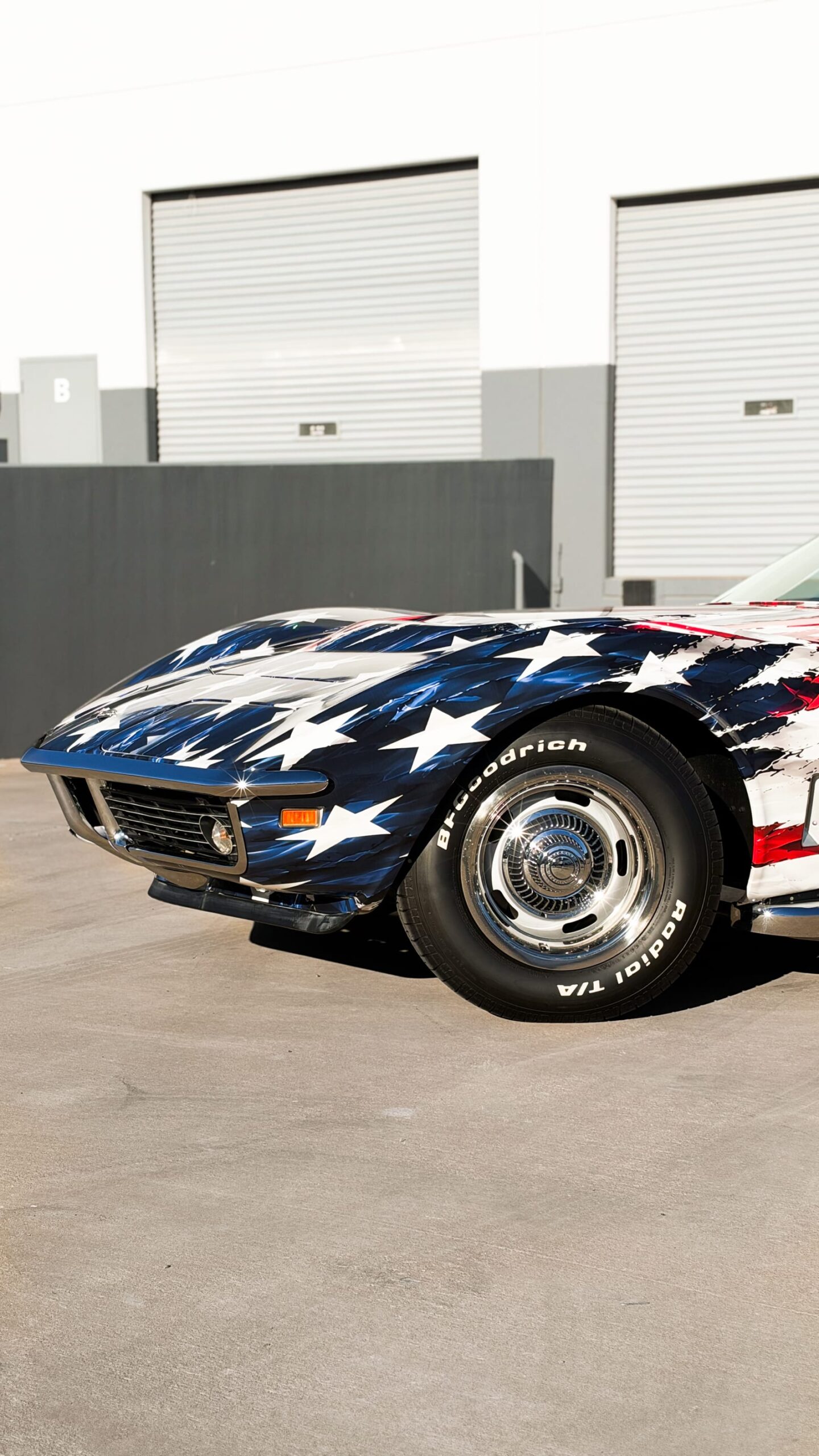 1969 Chevrolet Corvette Stingray with a custom printed wrap flag design at Purple Flare Wraps Henderson