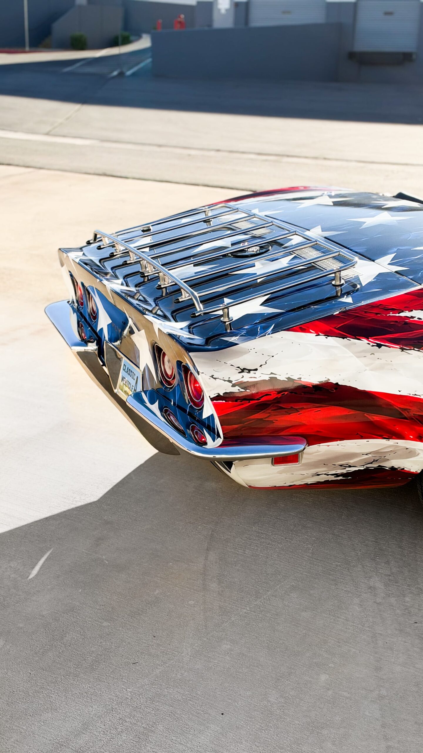 1969 Chevrolet Corvette Stingray with a custom printed wrap flag design at Purple Flare Wraps Henderson