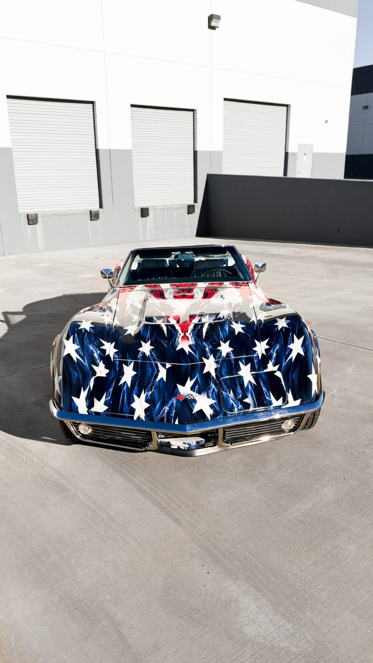 1969 Chevrolet Corvette Stingray with a custom printed wrap flag design at Purple Flare Wraps Henderson