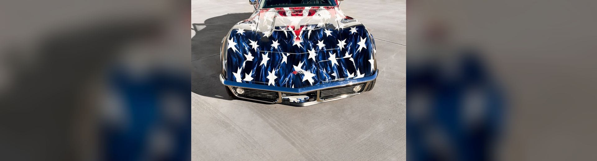 1969 Chevrolet Corvette Stingray with a custom printed wrap flag design at Purple Flare Wraps Henderson